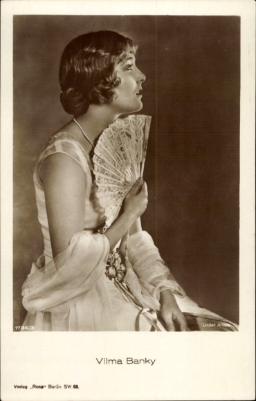 Postcard actress Vilma Banky, side view, fan