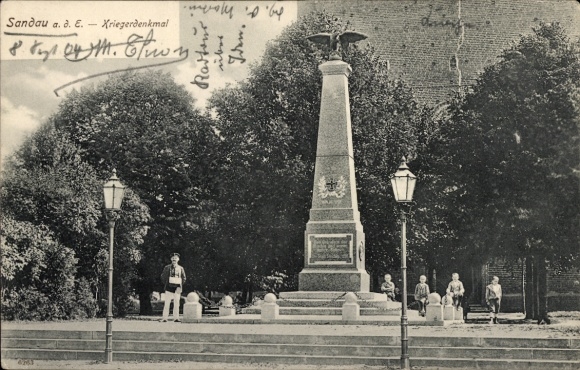 Postcard Sandau on the Elbe, war memorial, people, lanterns, trees, monument, bike tour