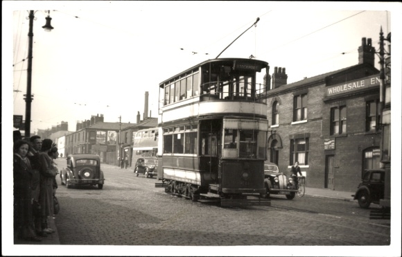 Photo British tram, traffic, shops