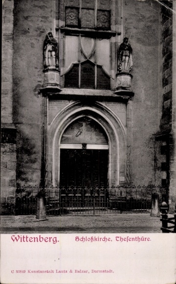 Postcard Lutherstadt Wittenberg, facade of the Castle Church, theses door, two figures on the wall