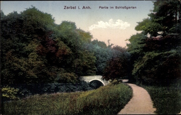 Postcard Zerbst in Anhalt, beautiful park landscape, bridge, wooded path, sky with clouds