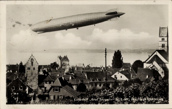 Postcard Meersburg on Lake Constance, airship Graf Zeppelin over the city