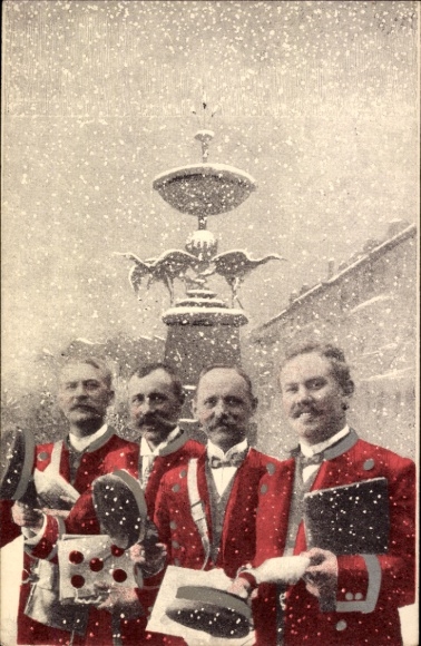 Postcard Four postmen in red uniforms, winter, snow