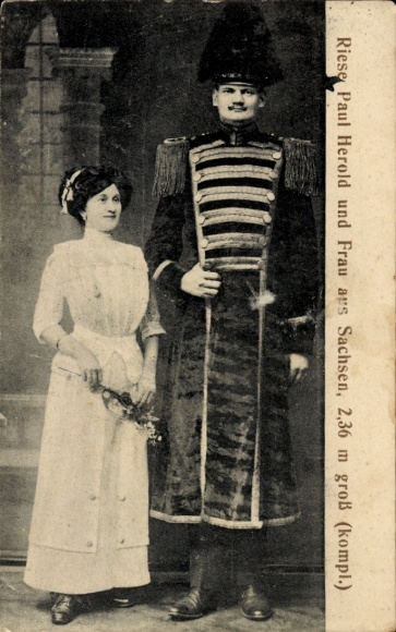 Postcard uniformed giant Paul Herold with his wife