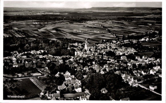 Aerial photograph of Wiesentheid in Lower Franconia, church, residential buildings, surrounding fields