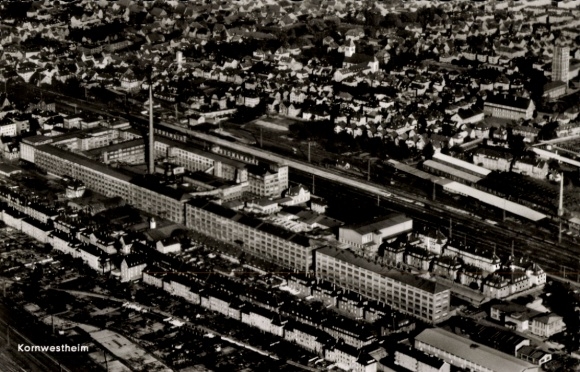 Postcard Kornwestheim in Württemberg, aerial view of factory buildings, residential areas, railway tracks