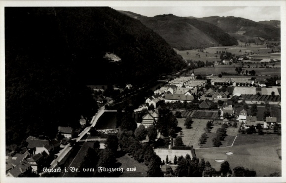 Postcard Gutach im Breisgau Black Forest, aerial view of Gutach, mountains in the background, river and houses