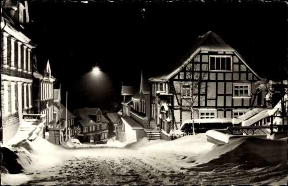 Postcard Bad Berleburg in Westphalia, snow-covered street, half-timbered houses, night shot