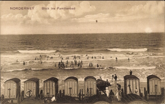 Postcard North Sea resort Norderney East Frisia, view of beach life, beach chairs, many swimmers in the water