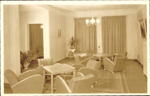Postcard Oberhof in the Thuringian Forest, cozy club room, plants, furniture, large windows, soft lighting