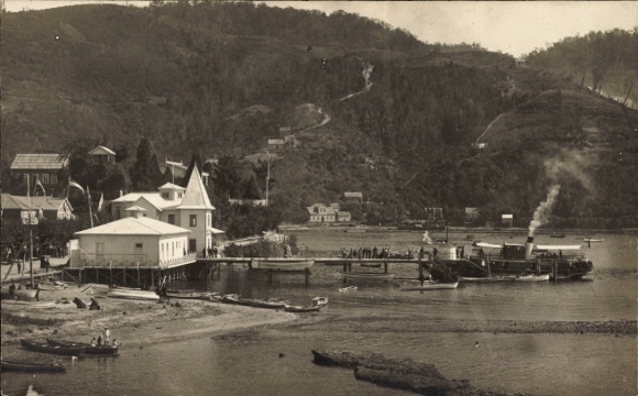 Postcard Corral Chile, ship in the harbor, mountains in the background, architecture