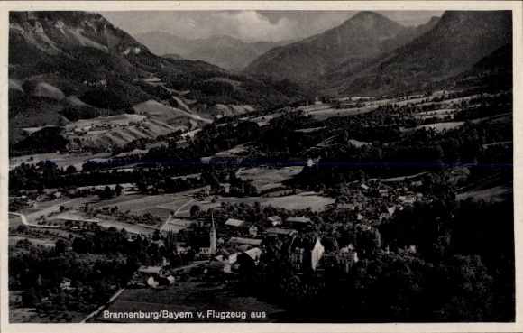 Postcard Brannenburg in Upper Bavaria, aerial view of mountains in the background, architecture