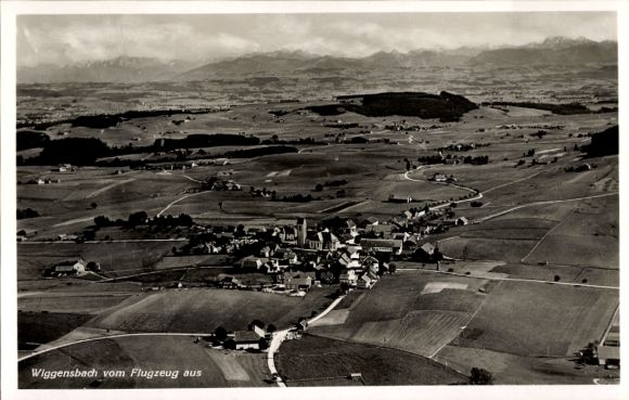 Postcard Wiggensbach in Allgäu, aerial view of wide landscape, mountains in the background