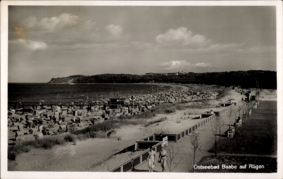 Postcard Ostseebad Baabe on Rügen, people on the beach, a beach promenade, behind it a street ...