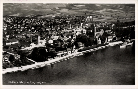 Ak Eltville am Rhein Hessen, Luftaufnahme von Eltville, Fluss und Stadtansicht