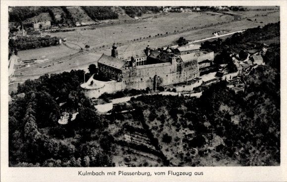 Postcard Kulmbach in Upper Franconia, aerial view of the Plassenburg, castle on a hillside, surrounding landscape
