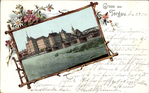 Ak Torgau an der Elbe,  mit Fluss, Brücke, Stadtansicht, Blumenrahmen, Text 'Gruss aus Torgau'