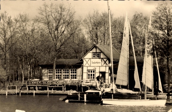 Postcard Plau am See Mecklenburg, houses on the water, sailboats, trees, sailors' home
