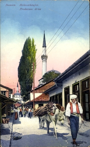 KP Sarajevo Bośnia Hercegowina, sprzedawca drewna, ulica, domy, minaret, postać męska, bydło