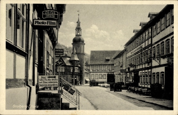 Postcard Stolberg in the Harz, town view with half-timbered houses, church tower, shops, street view