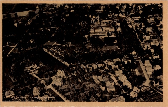 Postcard Bad Pyrmont in Lower Saxony, aerial view of buildings and trees visible