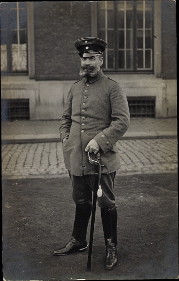 Photo Postcard German soldier in uniform, standing portrait, beard, sabre