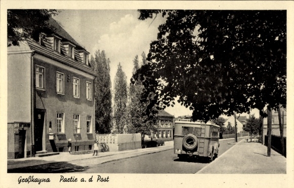 Ak Großkayna Braunsbedra Saalekreis, gevel van een gebouw, straat, bus, bomen, blauwe lucht