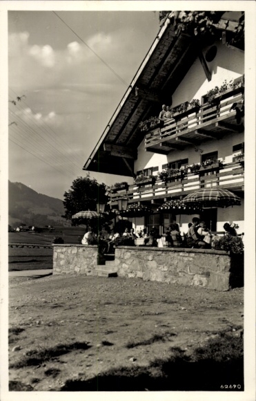 Postcard Nesselwang in Allgäu, guesthouse and guesthouse "zum Löwen", terrace with guests, mountain view, black