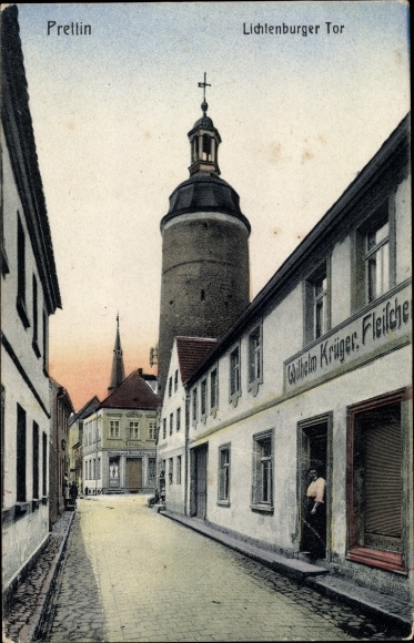 Postcard City of Prettin Annaburg in the district of Wittenberg, Lichtenburger Tor, butcher shop