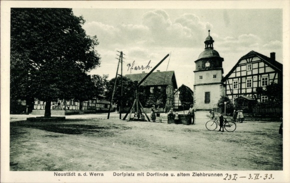 Postcard Neustädt Gerstungen in Thuringia, village square, village linden tree, old draw well, bicycles, buildings