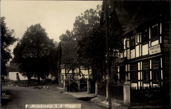 Foto Ak Meinbrexen Lauenförde im Weserbergland, Wirtschaft zur Linde, Fachwerkhäuser, Straßenpartie