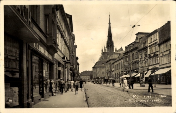 Photo Postcard Mühlhausen Thuringia, Hindenburgstraße with shops