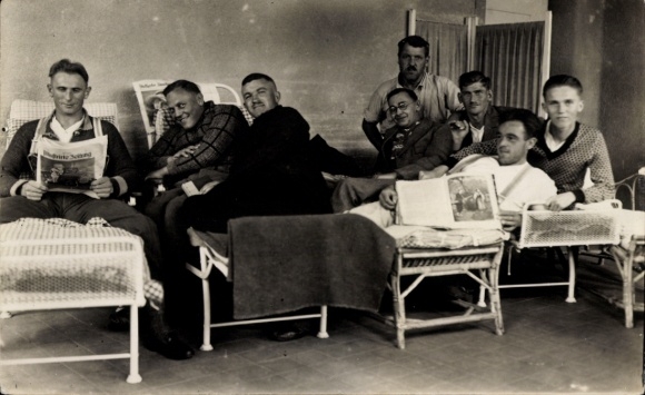 Photo Postcard Young men reading the newspaper