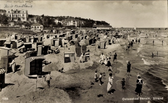 Postcard Ostseebad Bansin on Usedom, beach of Ostseebad many beach chairs, people at the water