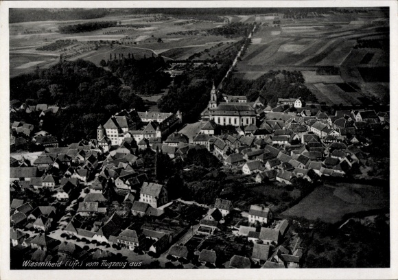 Postcard Wiesentheid in Lower Franconia, aerial view of church, buildings