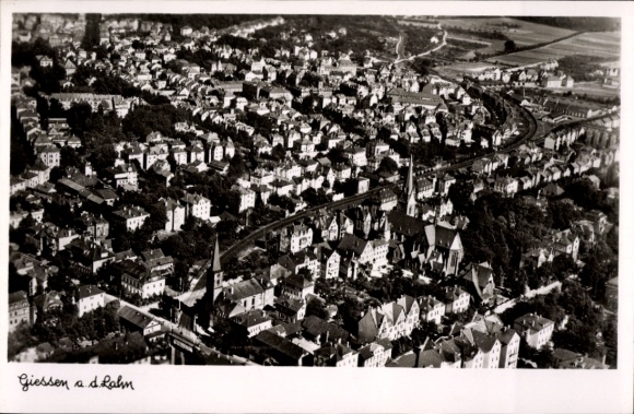 Postcard Gießen an der Lahn Hesse, aerial view of many houses, church, tracks, landscape