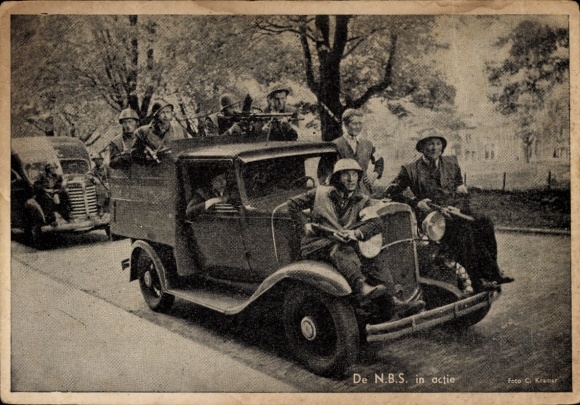 Postcard NBS soldiers armed in and on a vehicle, Canadian Army, WWII