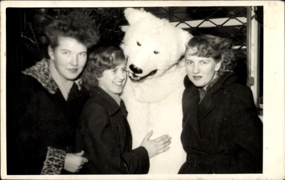 Photo Berlin, women and person in polar bear costume at the Christmas market in 1953