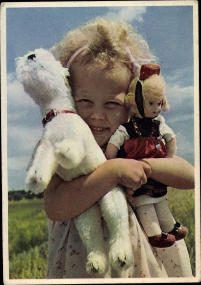 Postcard girl with costume doll and plush dog
