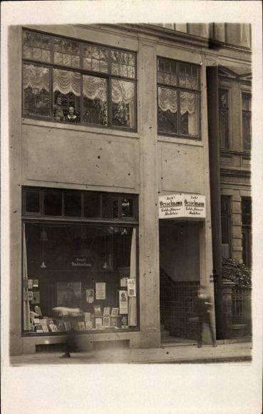 Photo Postcard Street scene at a shop, bookshop