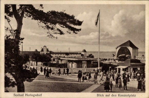 Postcard Ostseebad Heringsdorf on Usedom, seaside resort view of the concert square, people, trees, flag,