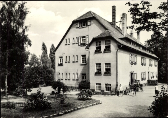 Postcard Neukirch in der Lausitz, beautiful building, people on the way, park with trees, bushes