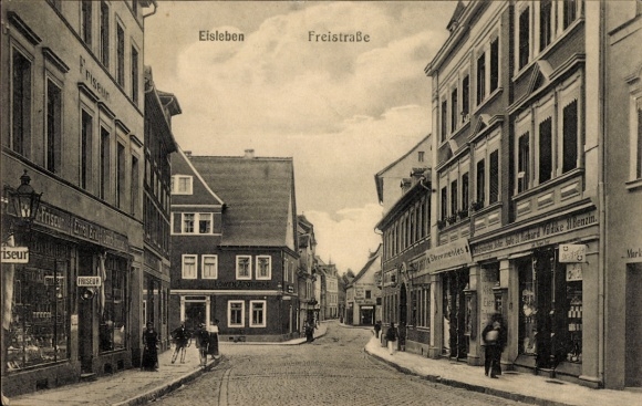 Postcard Lutherstadt Eisleben, Freistraße, shops, hairdresser