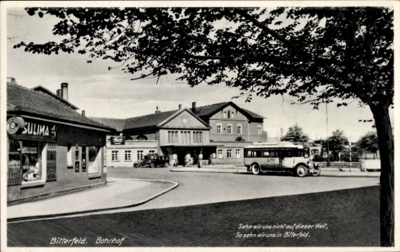 Postcard Bitterfeld in Saxony-Anhalt, train station, forecourt, bus, shop Sulima
