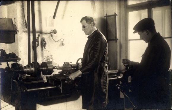 Photo Postcard Two men in a workshop, machine