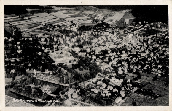 Postcard Bad Pyrmont in Lower Saxony, aerial view of the city, residents' houses, landscape