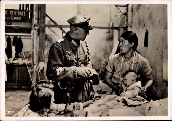 Photo of a German military doctor with a French civilian population, June 1940