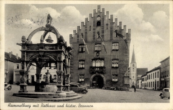 Hammelburg in Lower Franconia, Bavaria, town hall, historic fountain, cars, clouds, old archi...