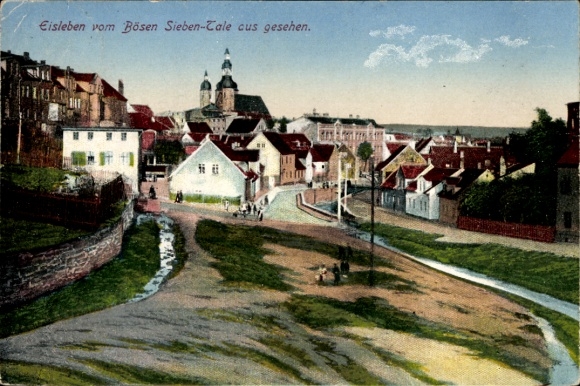 Postcard Lutherstadt Eisleben, view of the evil Seven Valleys, houses and church