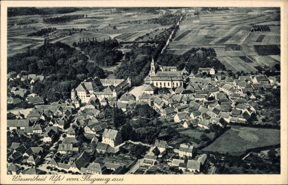 Postcard Wiesentheid in Lower Franconia, aerial view of houses, church, fields